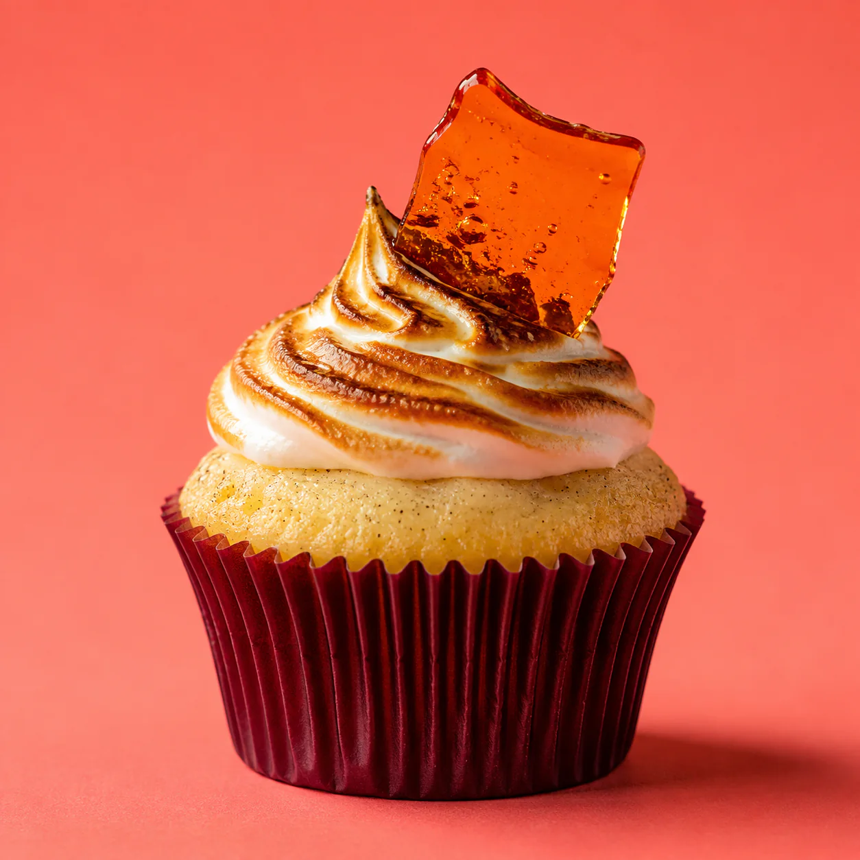 Vanilla cupcake with torched meringue and a caramel shard
