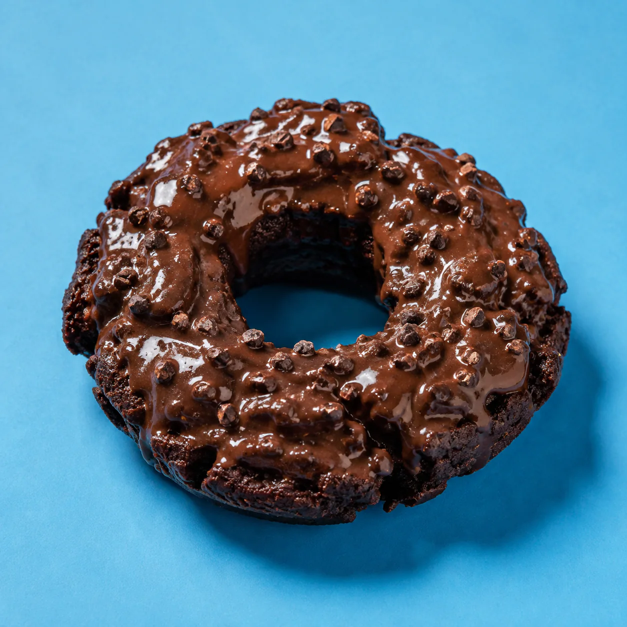 Dark chocolate old-fashioned donut with glossy mocha glaze